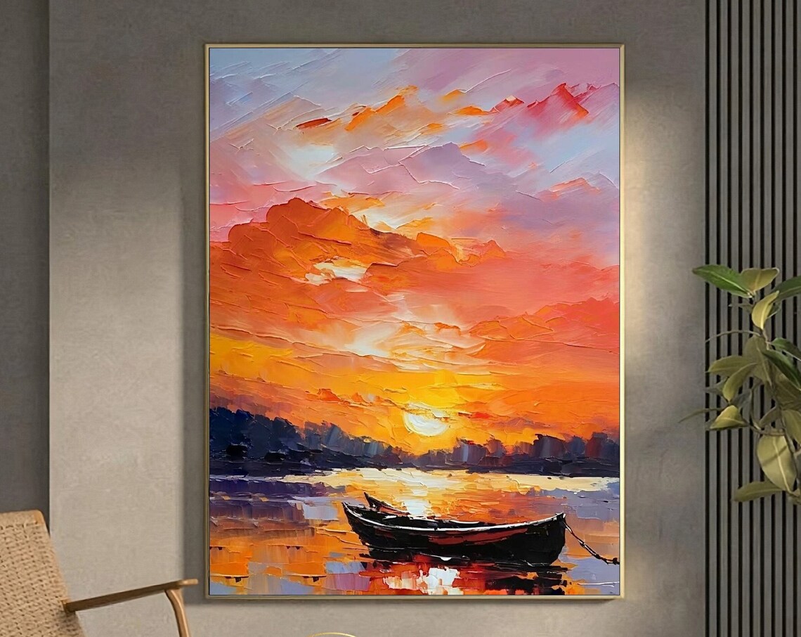 Vibrant Orange Sunset and Lone Boat Over Golden Water Poster
