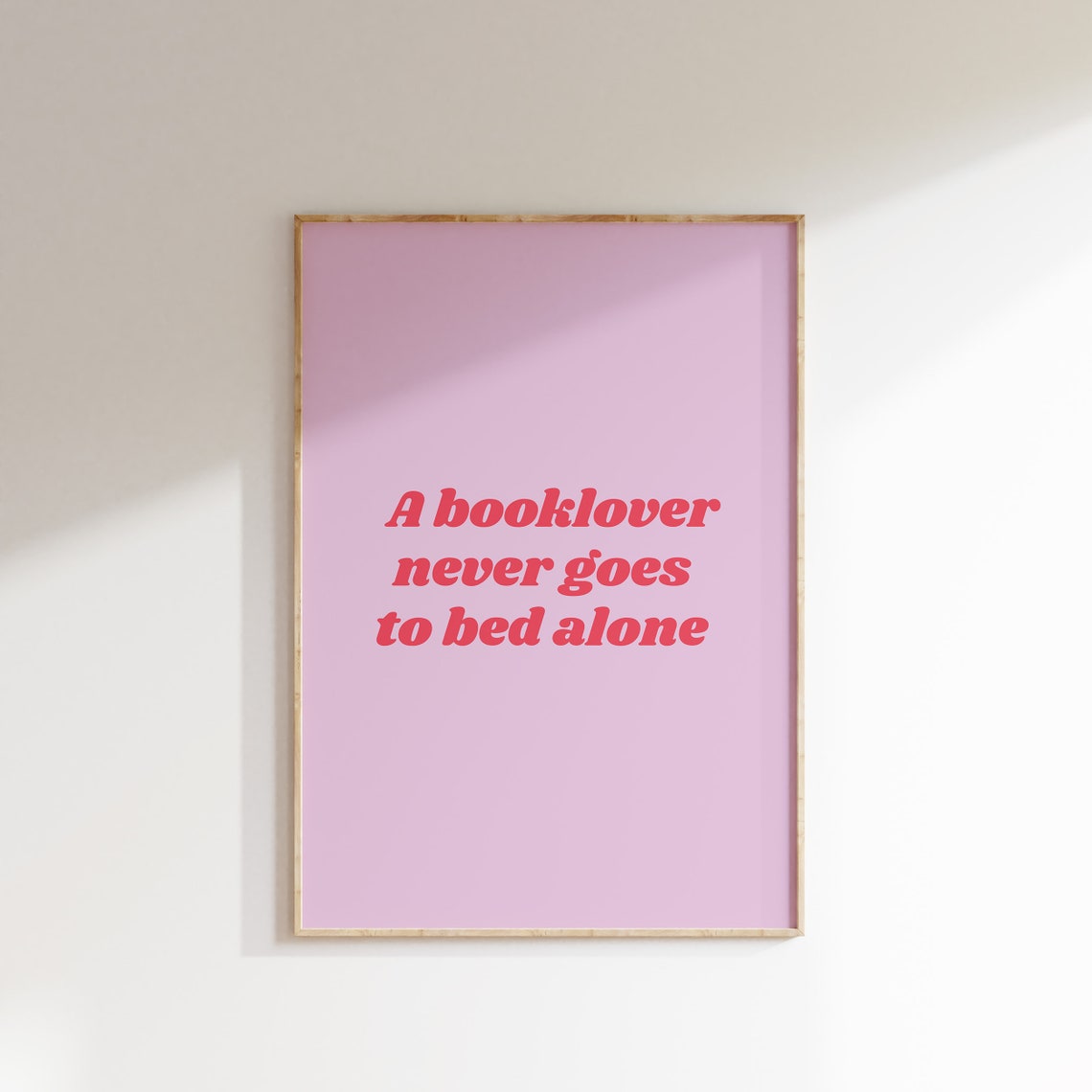 A Booklover Never Goes to Bed Alone Funny Reading Quote Pink Poster