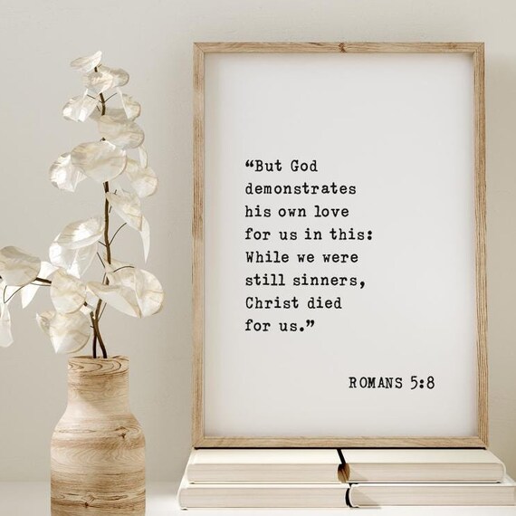 Romans 5:8 Bible Verse But God Demonstrates His Own Love Poster