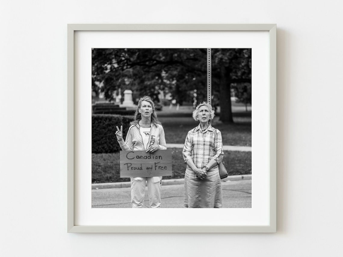 Two Women Holding Canadian Proud and Free Protest Sign Photo Poster