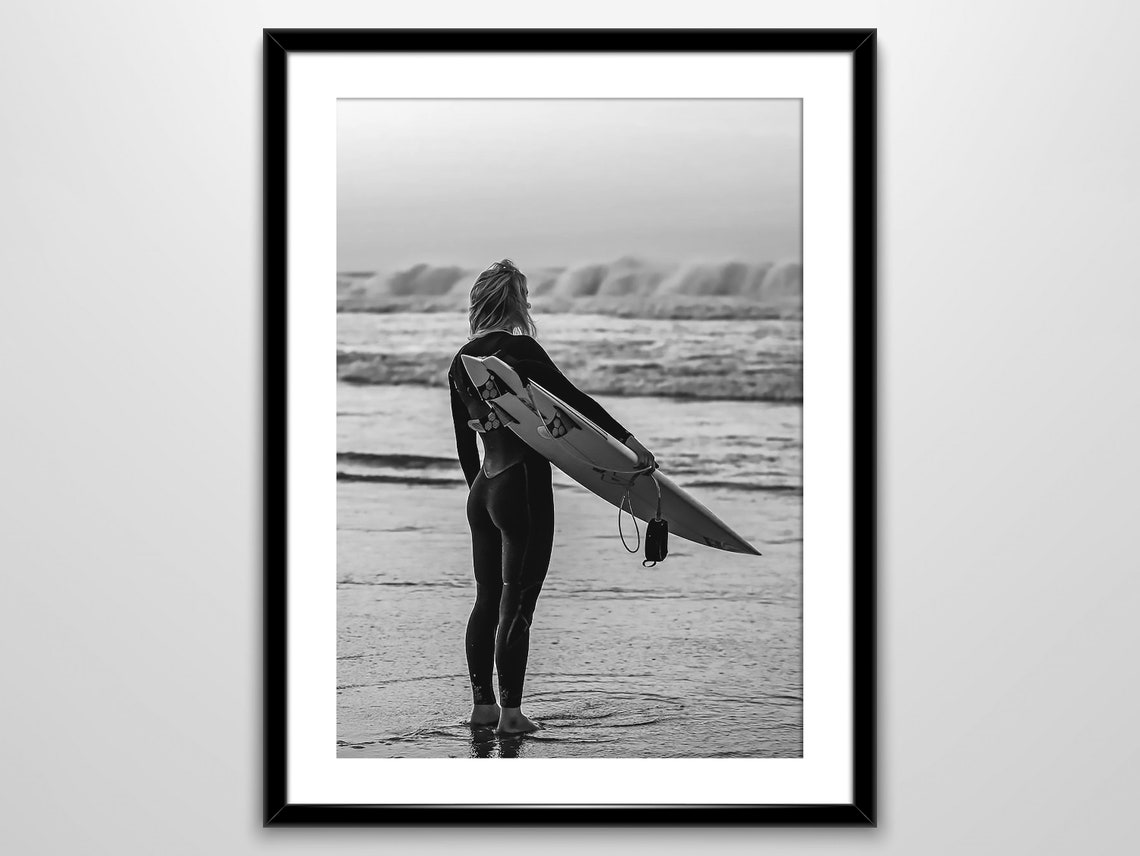 Woman in Wetsuit Holding Surfboard Watching Waves Beach Poster - Image 3