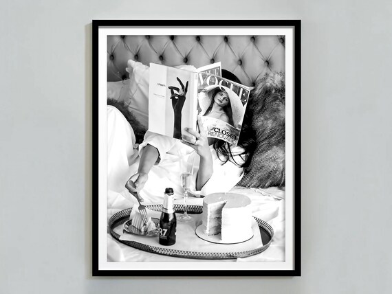 Woman Reading Vogue Magazine in Bed Black and White Photo Poster