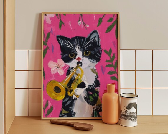 Playful Tuxedo Kitten Playing Golden Trumpet On Pink Floral Poster