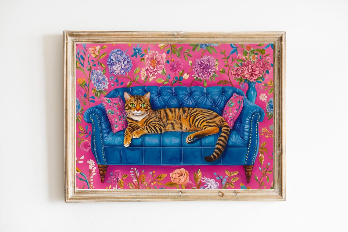 Bengal Tabby Cat Lounging on Blue Sofa With Floral Pink Poster