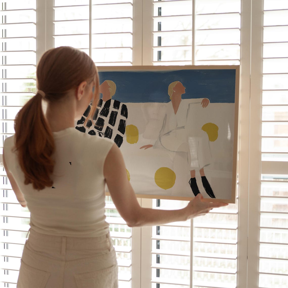 Two Seated Women Bold Checkered Patterns Beneath Blue Sky Poster - Image 3