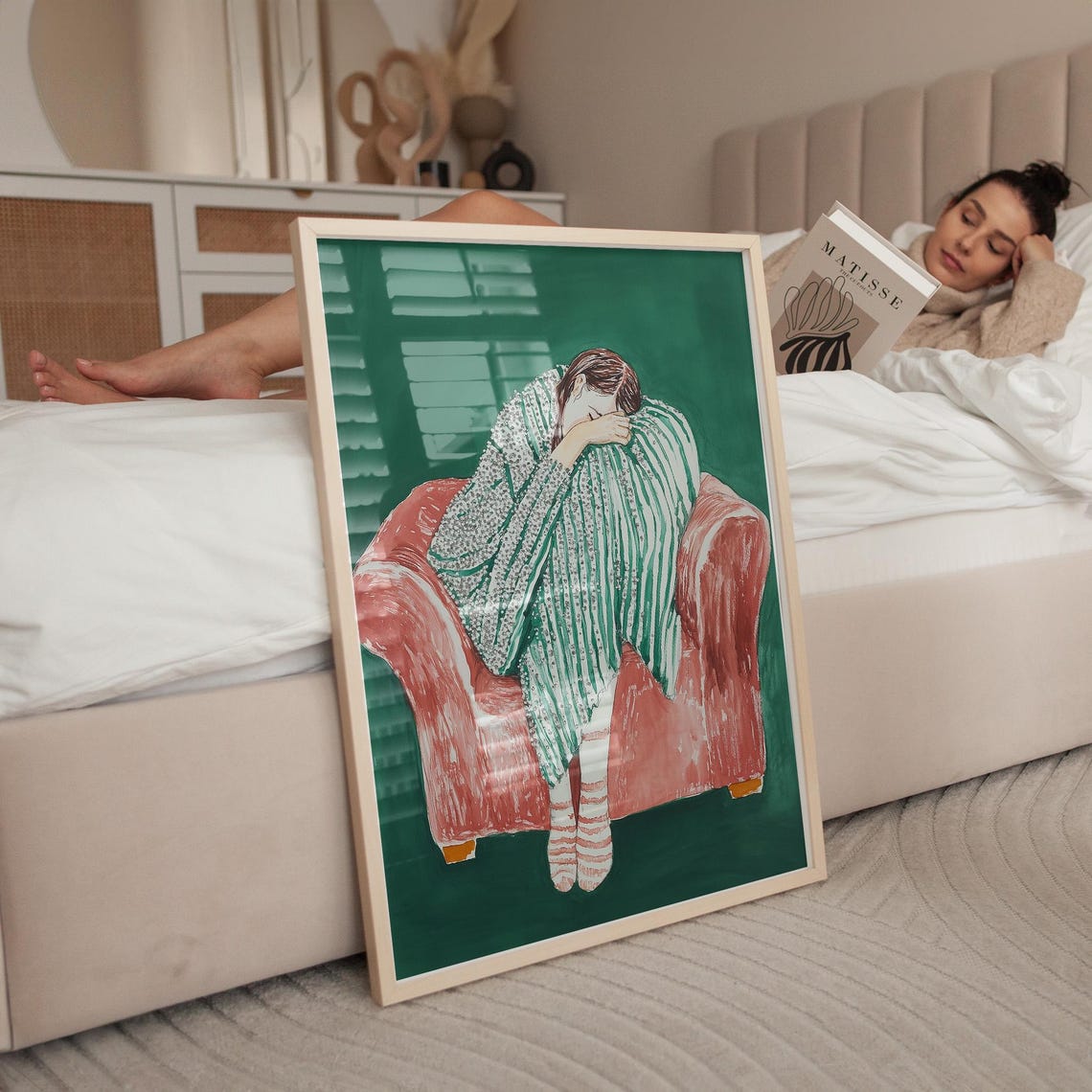 Woman Sleeping Curled in a Pink Armchair with Striped Blanket Poster - Image 5
