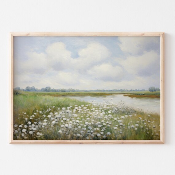 White Wildflowers Along Calm River Under Wide Cloudy Sky Poster