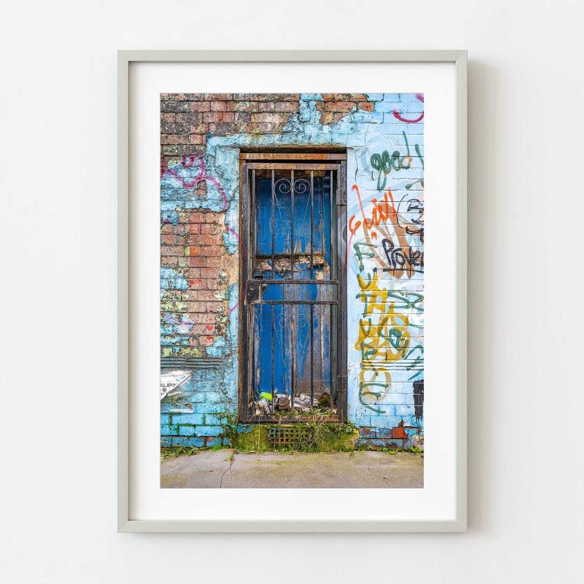 Weathered Blue Barred Door on Graffiti Brick Wall Urban Photo Print