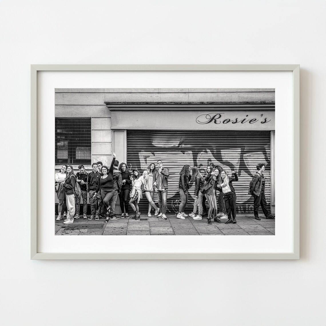 Black and White Photo of Teens Waiting Outside Rosies Shop Poster