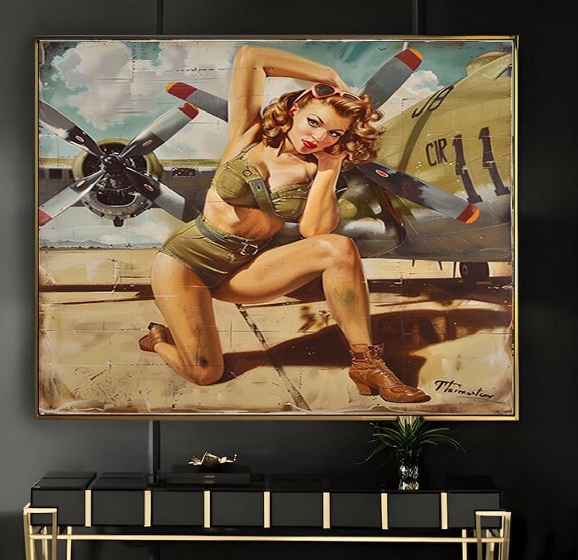 Pinup Girl in Khaki Shorts Kneeling by a Military Plane Poster