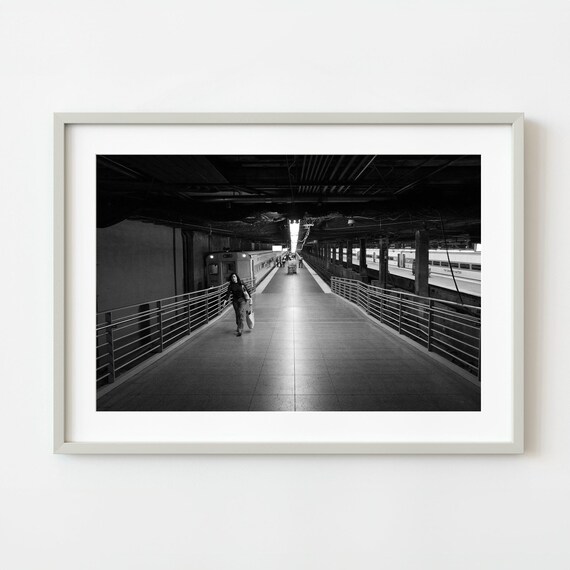 Solitary Woman Crossing Empty Train Station Platform Night Poster