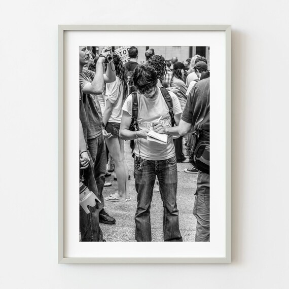 Young Photographer Taking Notes Crowd Black And White Photo Poster