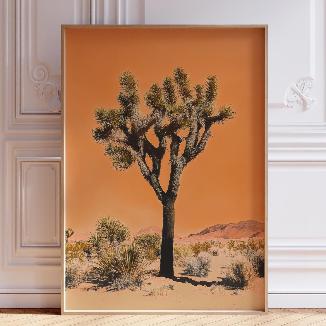 Lone Joshua Tree Silhouette Against Burnt Orange Desert Sky Poster
