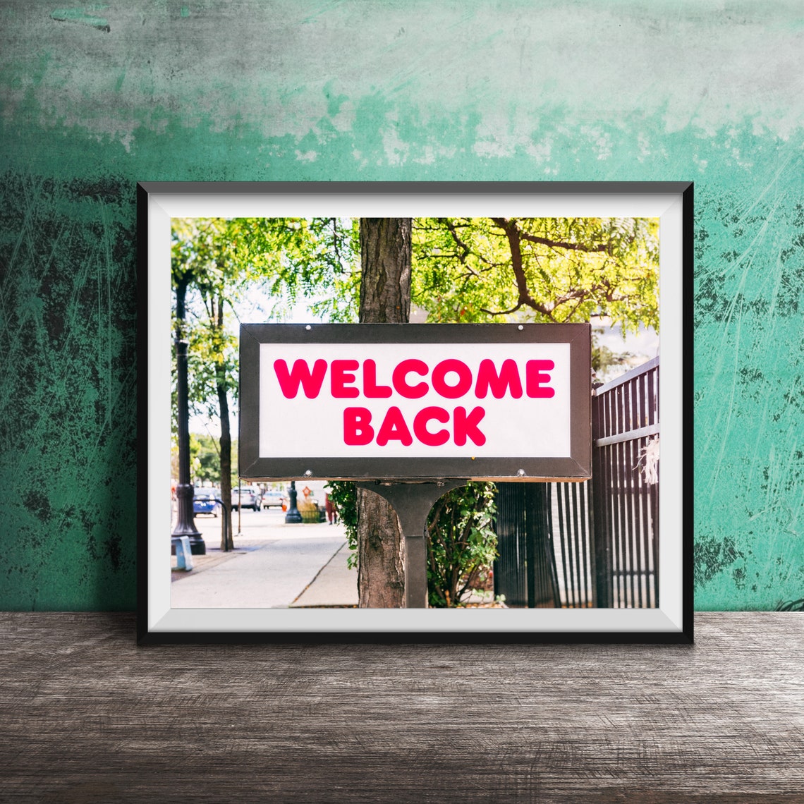 Welcome Back Pink Signpost on Tree-Lined Sidewalk Photography Poster