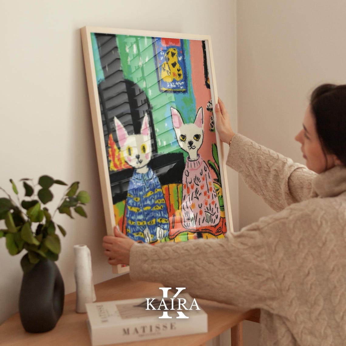 Two Cats Wearing Cozy Patterned Sweaters by a Warm Fireplace Poster - Image 2