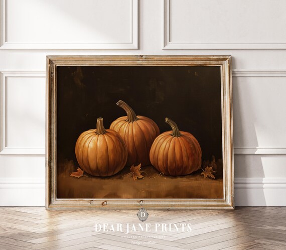 Three Orange Pumpkins On Dark Moody Background With Fall Leaves Poster