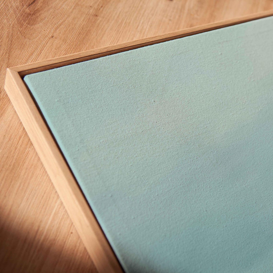Tiny Sailboat On Vast Calm Sea Under Soft Hazy Morning Light Poster - Image 2