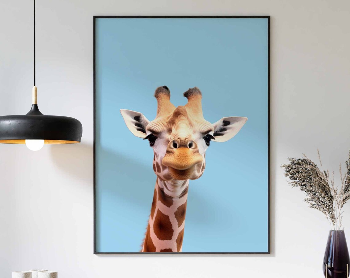 Baby Giraffe Looking Up at Camera on Bright Blue Background Poster