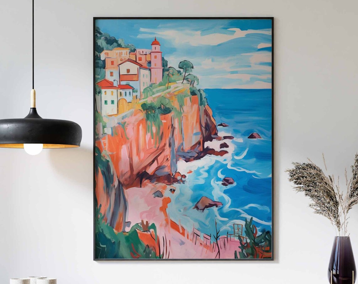 Pink Clifftop Village with Red Roofs Above the Blue Sea Poster