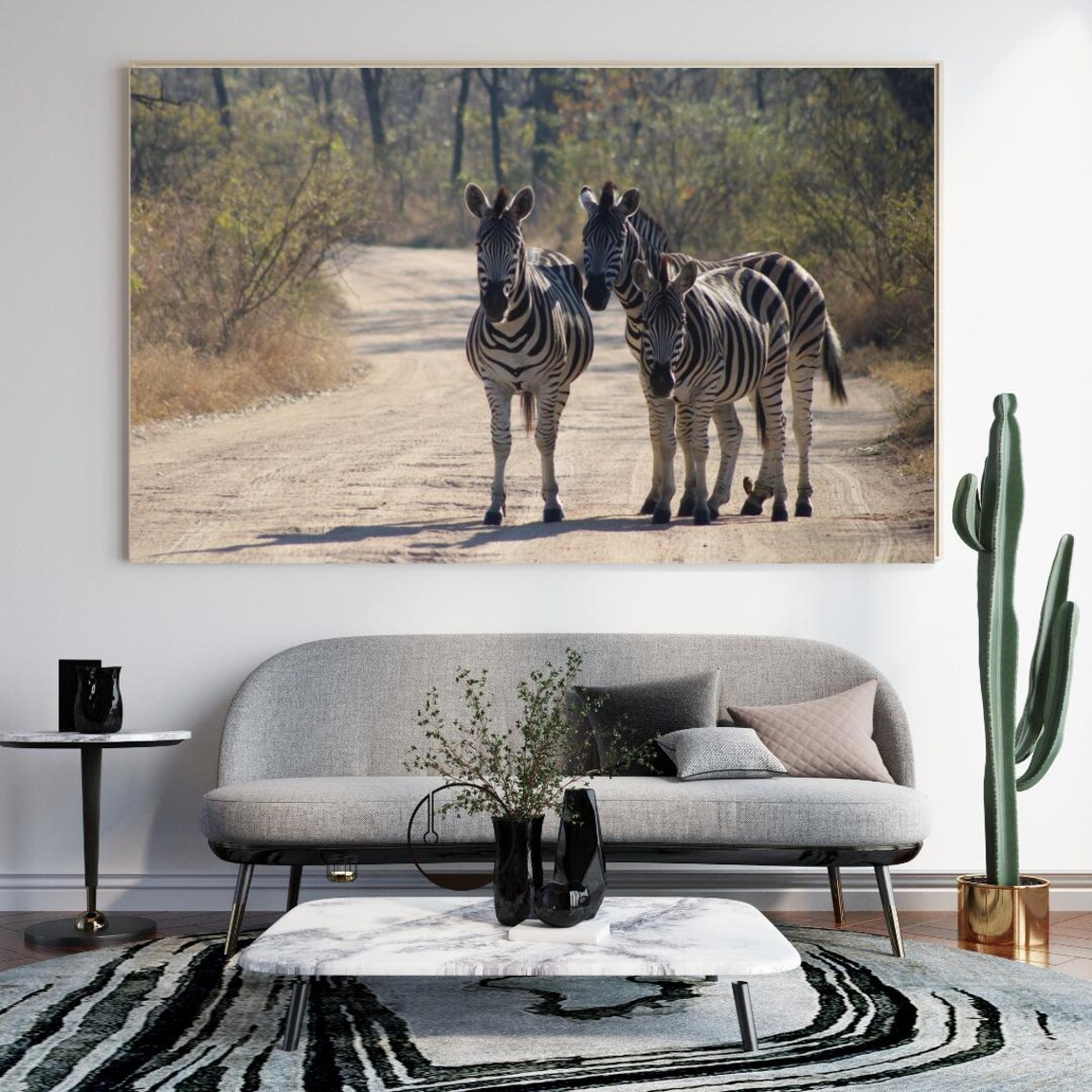 Three Zebras Standing On A Dusty Safari Road Facing The Camera Poster