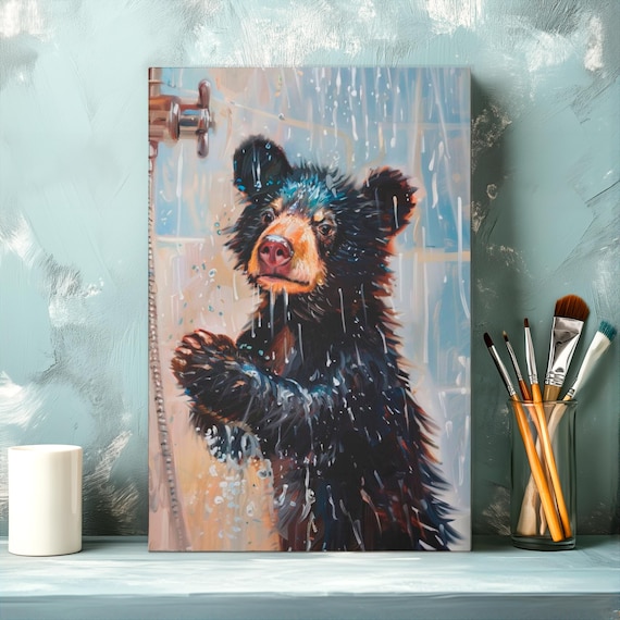 Black Bear Cub Playing Joyfully Under A Refreshing Shower Poster