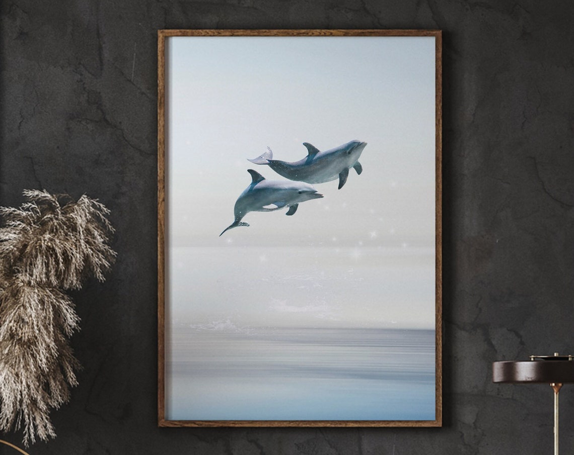 Two Dolphins Leaping Over Calm Ocean Waves Serene Marine Life Poster