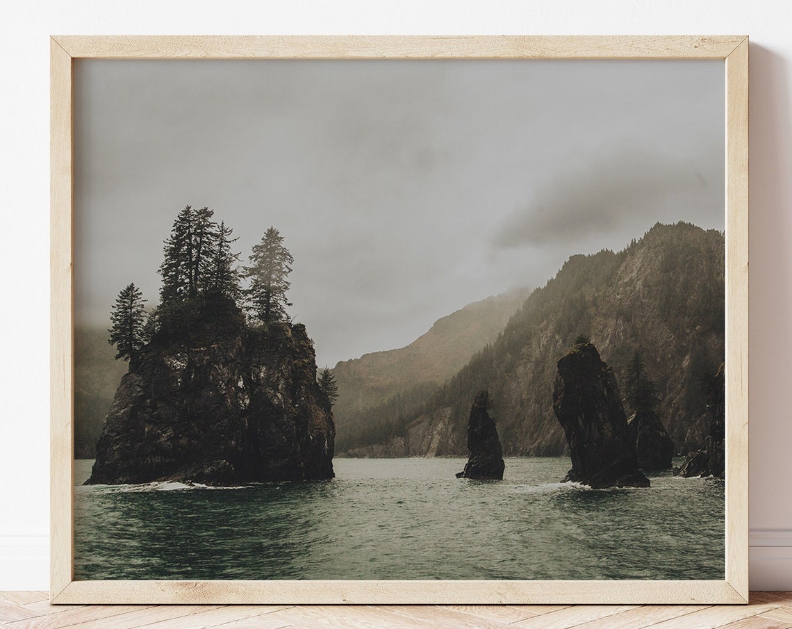 Misty Sea Stacks with Pine Trees Rising Over a Gray Ocean Poster
