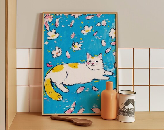 Happy Spotted White Cat Lounging Among Falling Blossom Petals Poster