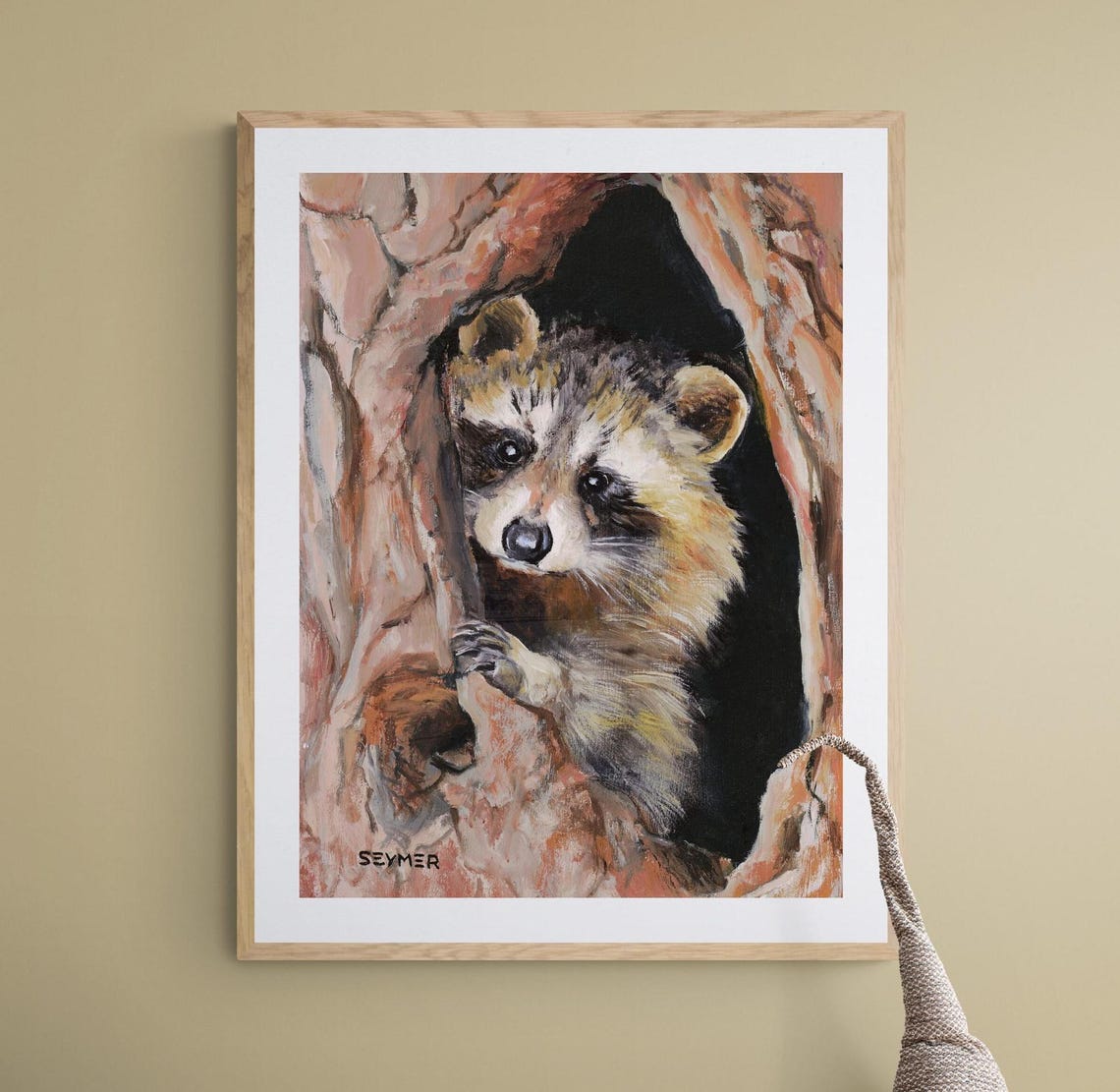 Curious Young Raccoon Peeking Out of a Hollow Tree Trunk Poster