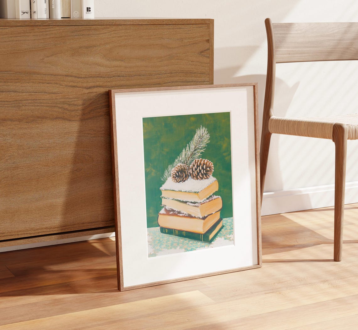 Stack of Books in Snow with Pinecones and Pine Sprig Still Life Poster