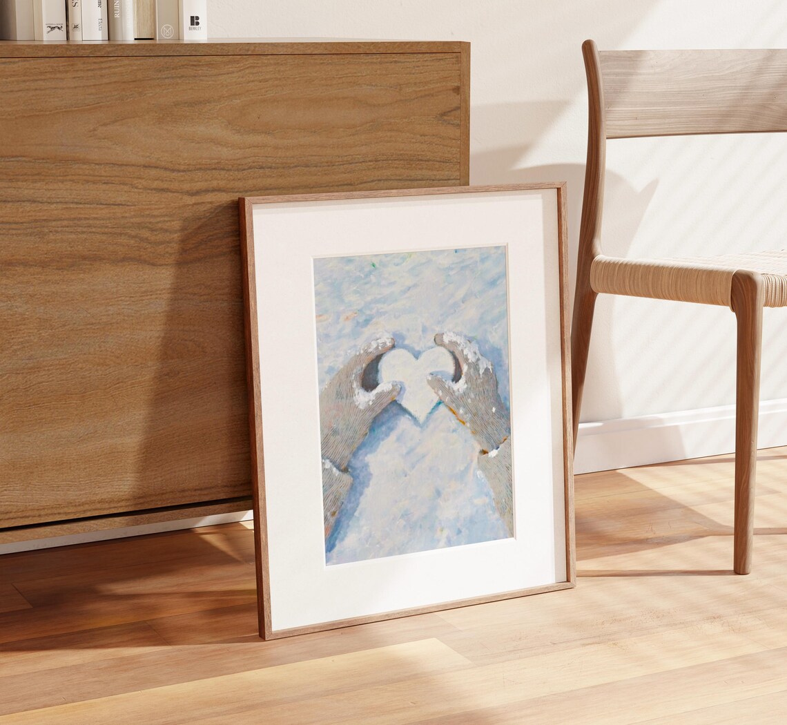 Gloved Hands Holding a Heart of Snow in Winter Landscape Poster - Image 2