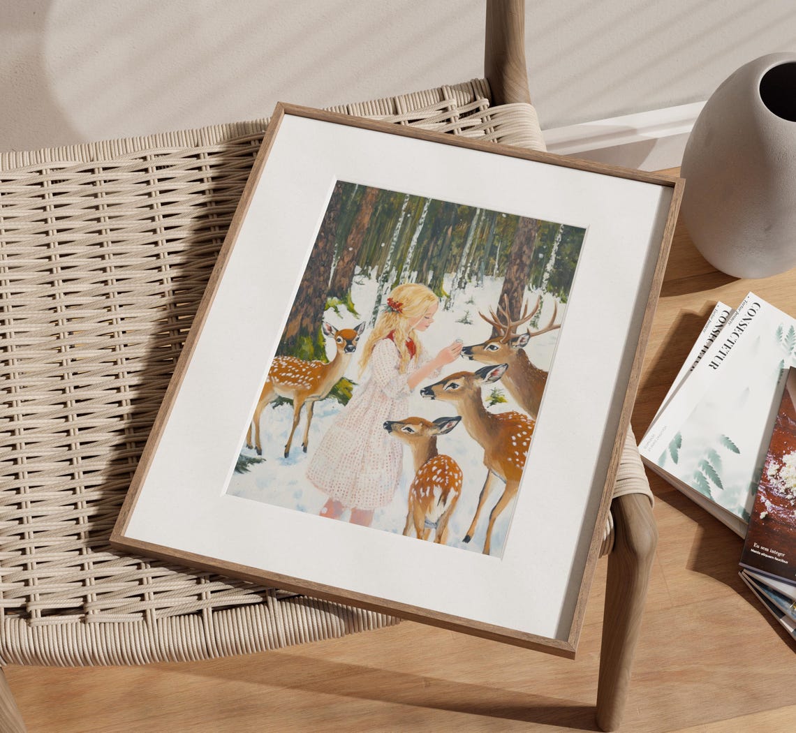 Young Girl in White Dress Feeding Deer in Snowy Forest Poster - Image 2