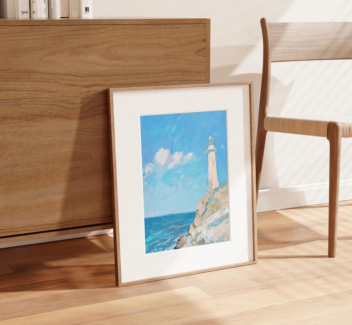 White Lighthouse Standing On Rocky Cliff Above Blue Ocean Poster - Image 3
