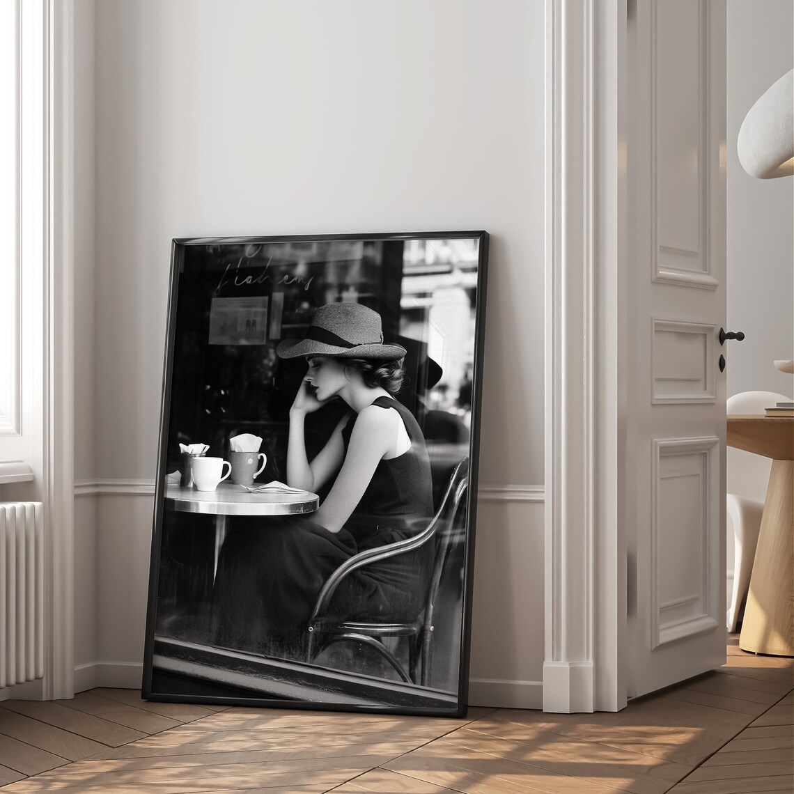 Black and White Photo Woman in Hat at French Cafe Table Poster - Image 2