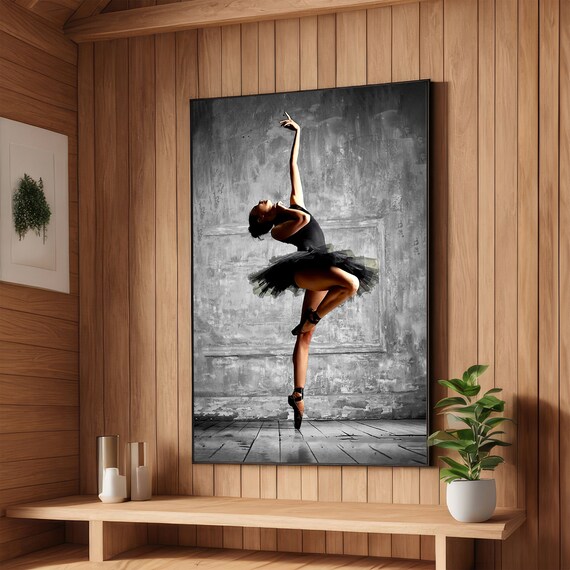 Graceful Ballerina in a Black Tutu Leaping Against Gray Wall Poster