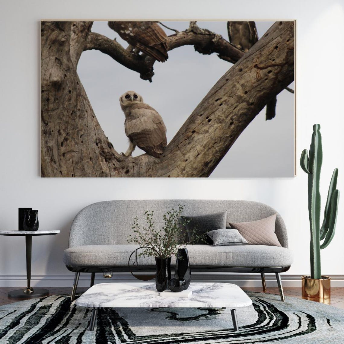 Young Eagle Owl Perched In A Tree With Parent Watching Over Poster