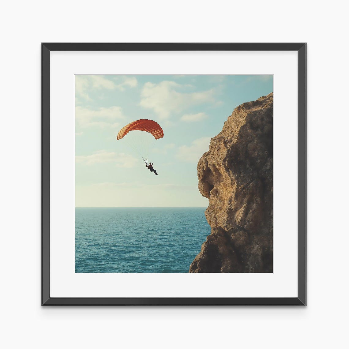 Orange Paraglider Soaring Over Sea Cliff Adventure Sports Poster