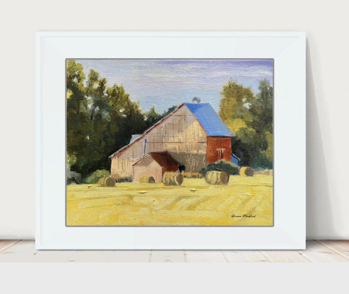 Rustic Barn And Rolled Hay Bales In A Golden Harvest Field Poster