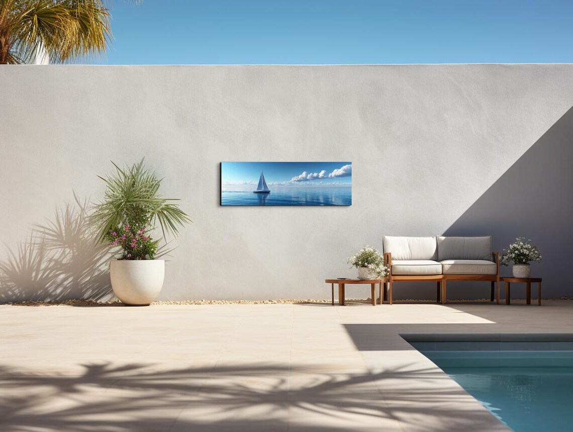 White Sailboat Gliding Across a Calm Blue Ocean Under Puffy Clouds Poster - Image 4