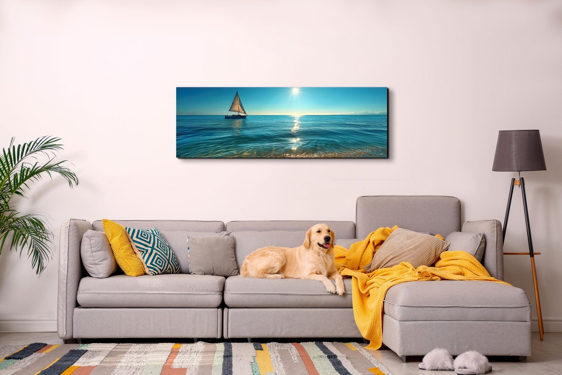 Serene Lone Sailboat Gliding Over a Calm Sunlit Blue Ocean Poster - Image 6