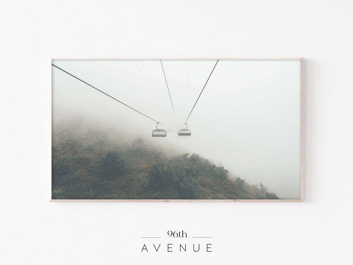 Ski Gondola Chairs Disappearing into Thick White Mountain Fog Poster