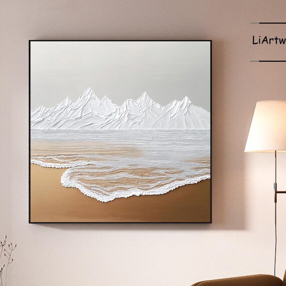 Textured White Mountain Peaks Over a Golden Sandy Shoreline Art Poster