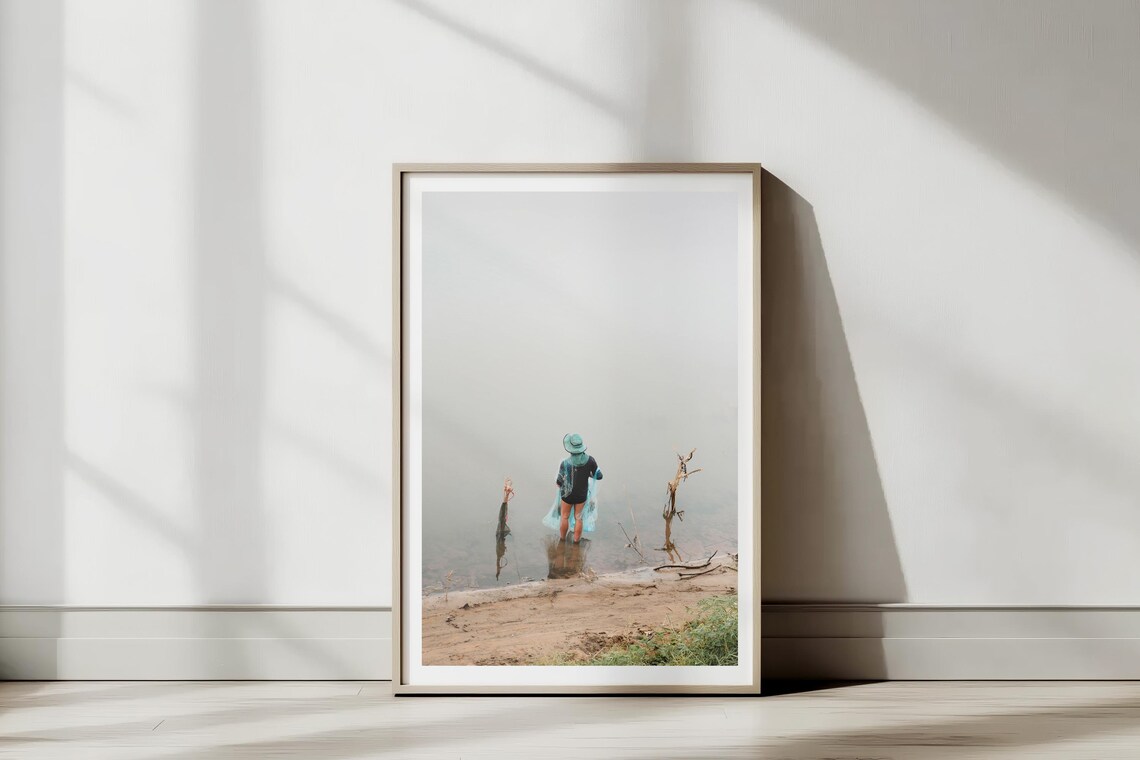 Woman in Blue Hat Standing at Foggy Lakeshore Minimalist Photo Poster