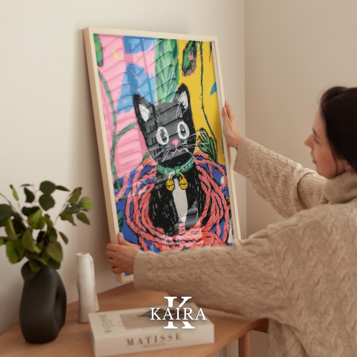 Black Kitten with a Golden Bell Collar Resting in Red Yarn Poster - Image 2