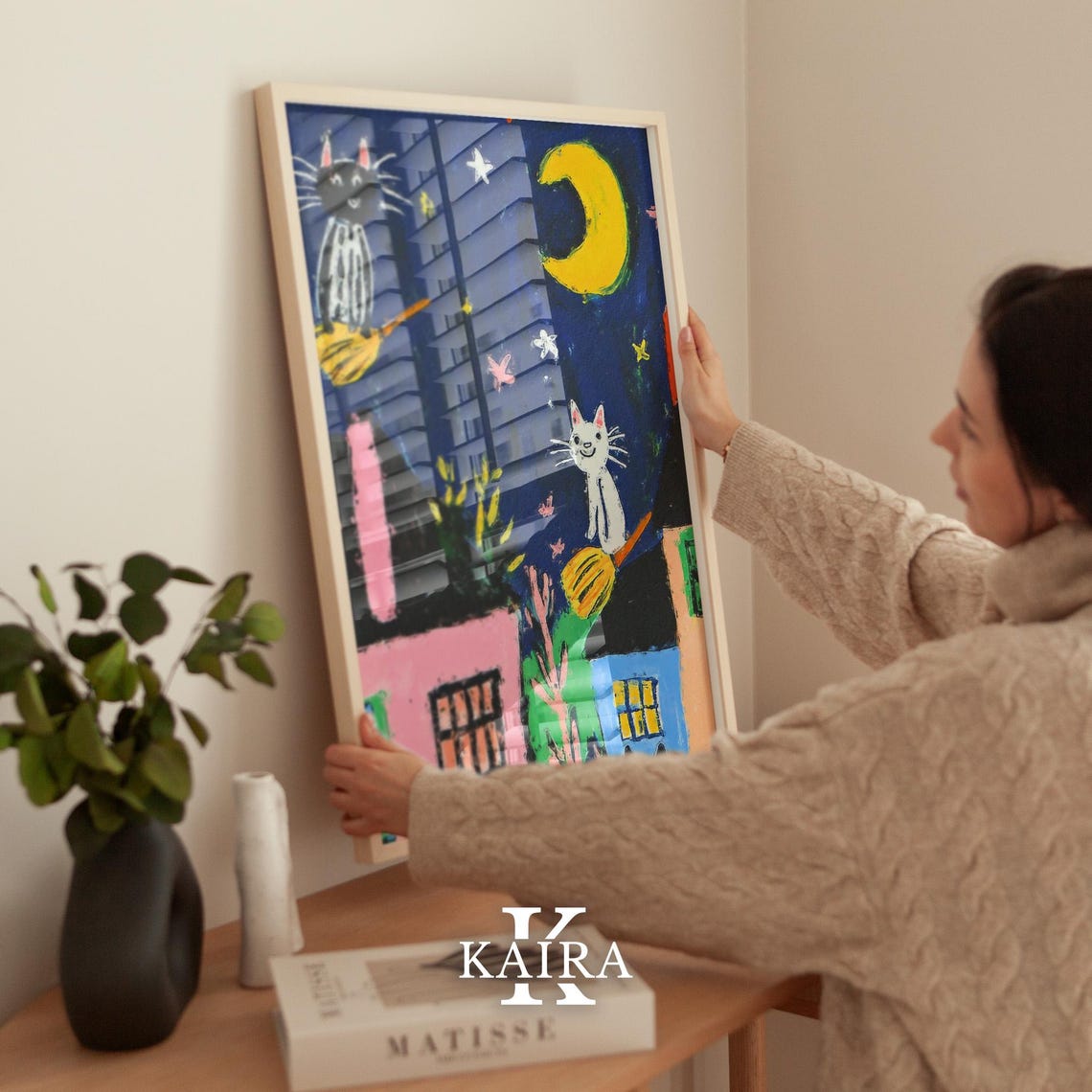 Two Playful Witch Cats Flying Over Houses on a Starry Night Poster - Image 2