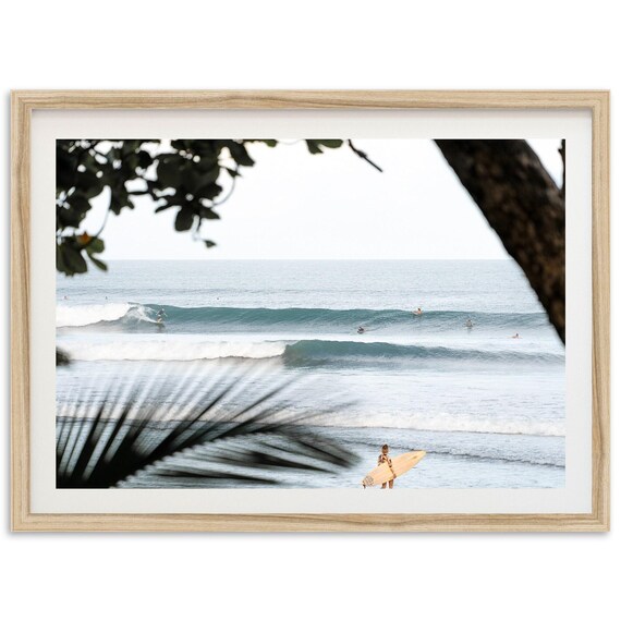 Surfers Riding Ocean Swell Framed By Tropical Palm Trees Poster