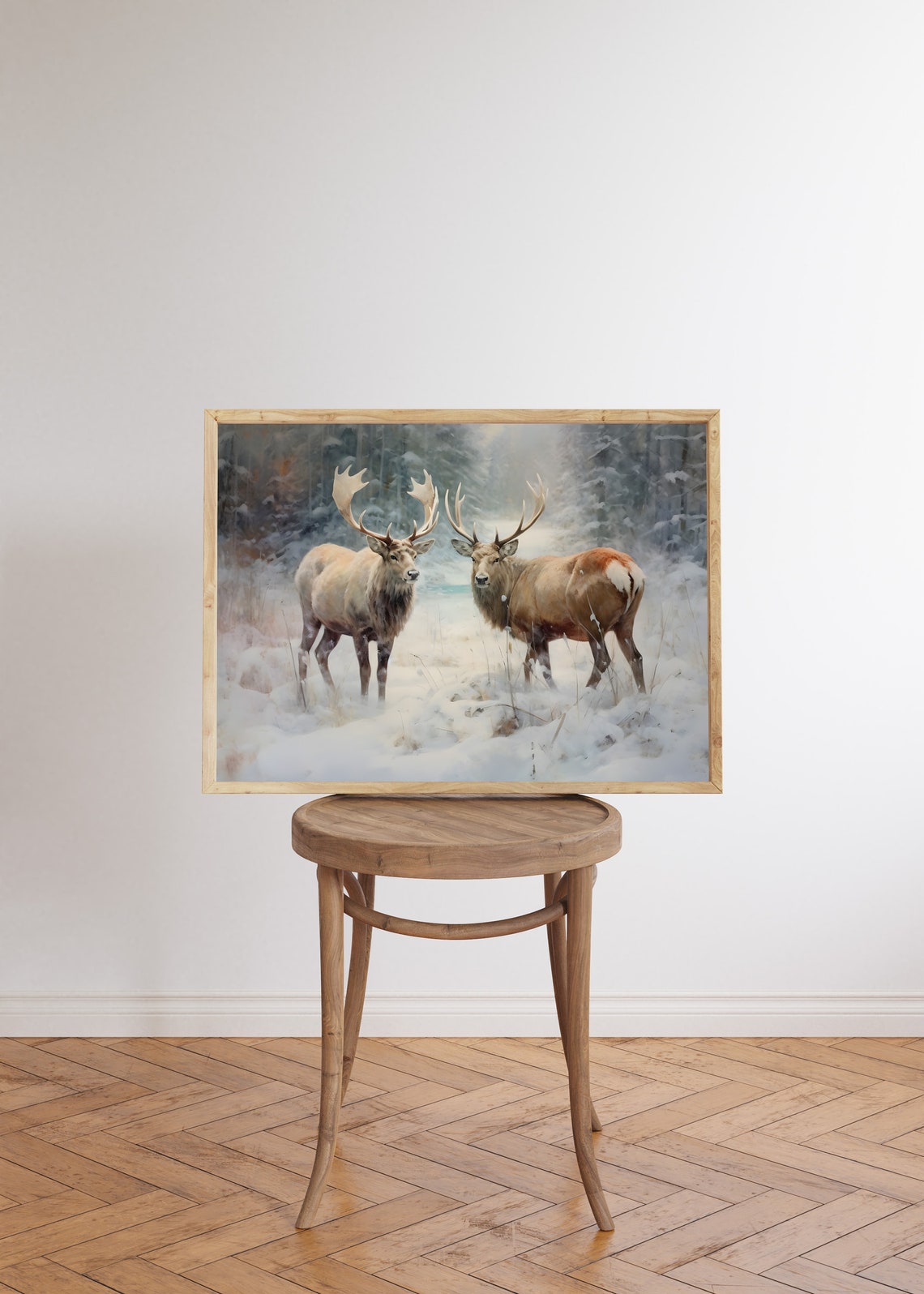 Two Majestic Stags Standing in Snow with Winter Forest Behind Poster - Image 5