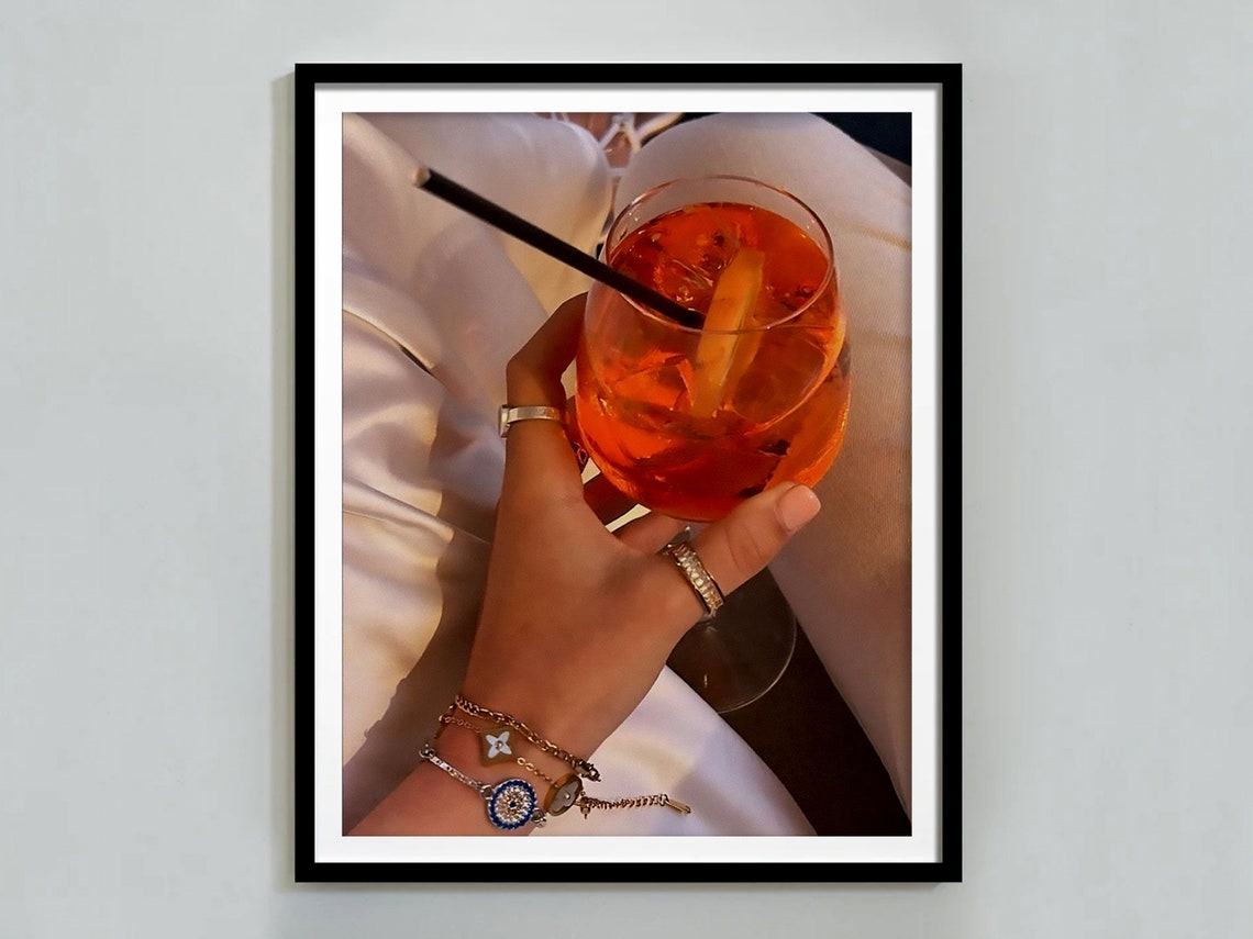Aperol Spritz Cocktail in Hand Close Up Bar Cart Photo Poster