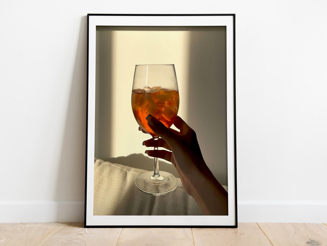 Hand Holding Aperol Spritz Glass in Sunlight Warm Bar Photo Poster - Image 2