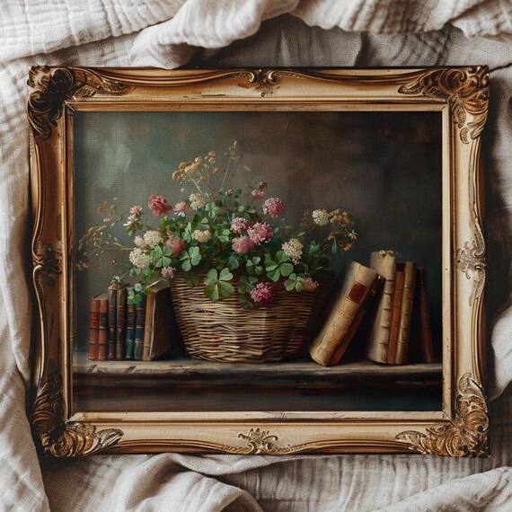 Clover and Wildflower Basket Resting Between Old Books Poster